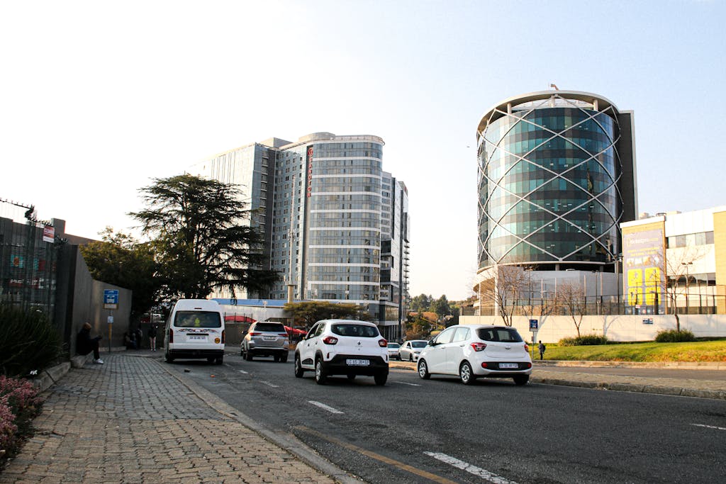 Home Urban scene of Johannesburg showing modern buildings and street traffic.